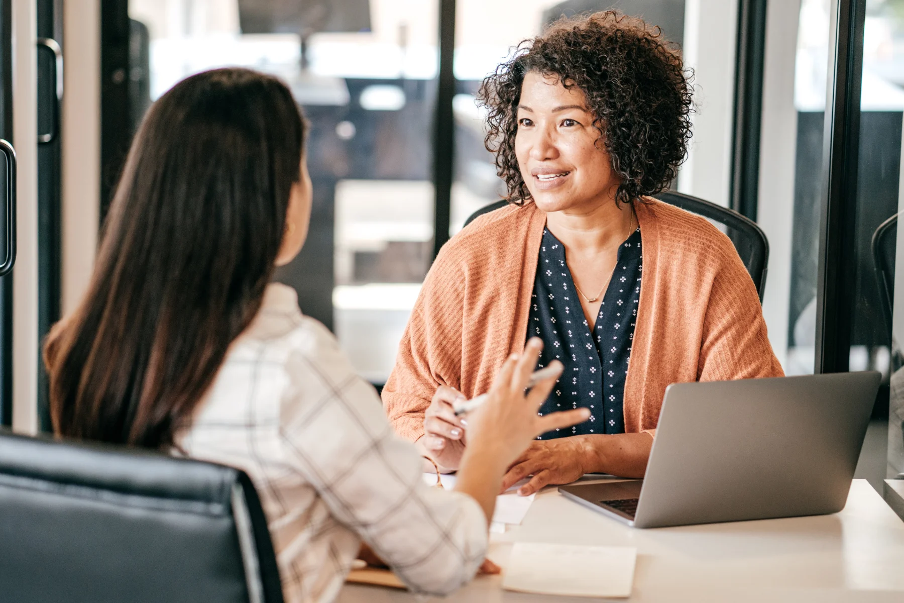 A woman interviewing a participant